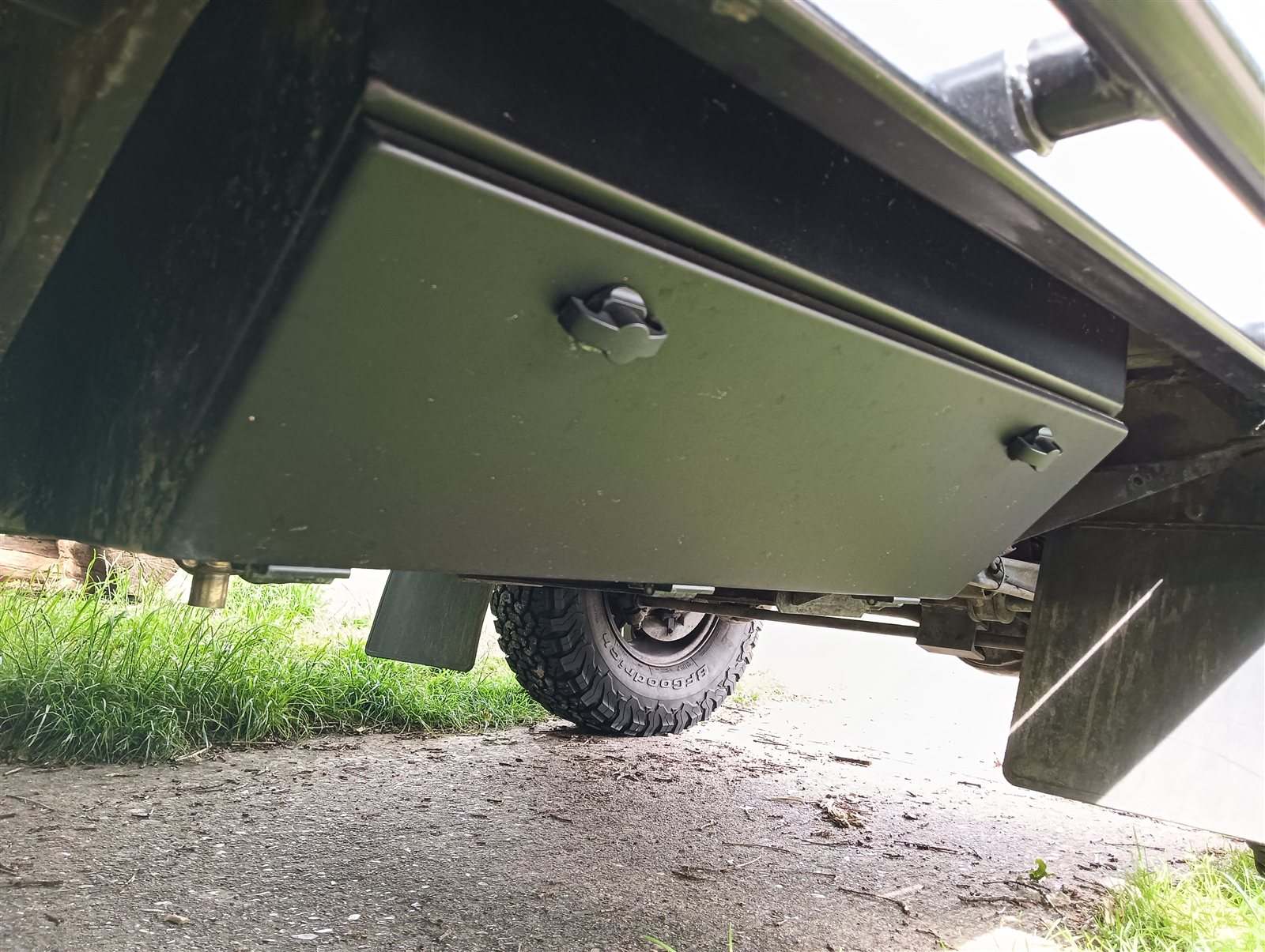 Chassis storage box mounted closed under a Land Rover Defender, wheel side